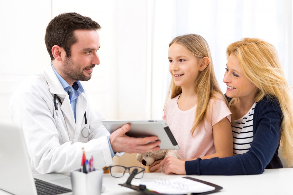 Little girl at the doctor with her mother